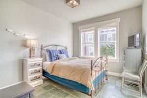 a bedroom with a bed and a window at Mill House in Lincoln City