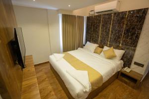 Postel nebo postele na pokoji v ubytování Clarks Inn , Airport Bangalore