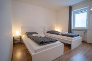 A bed or beds in a room at 4-Zimmer Haus, 2-Bäder 140qm bis zu 11 Personen