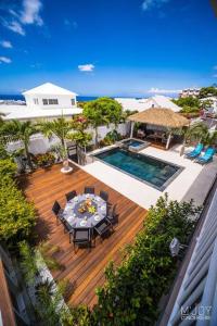 an aerial view of a patio with a table and a pool at Villa Rosaya in Saint-Pierre