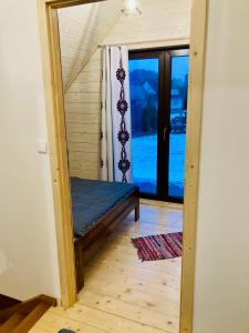 Postel nebo postele na pokoji v ubytování Domek Orawski