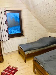 Postel nebo postele na pokoji v ubytování Domek Orawski