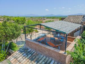 an overhead view of a house with a table and chairs at Villa Son Fullos in Santa Margalida