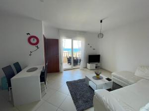 a living room with a couch and a table at Apartment Ana in Trogir