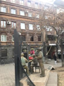 a group of people sitting at a table in front of a building at Yerevan, Abovyan 34 My street in Yerevan