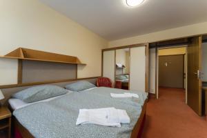 Postel nebo postele na pokoji v ubytování Hotel Amco