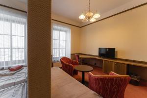 TV a/nebo společenská místnost v ubytování Hotel Amco