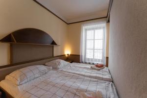 Postel nebo postele na pokoji v ubytování Hotel Amco