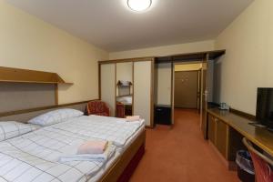 Postel nebo postele na pokoji v ubytování Hotel Amco