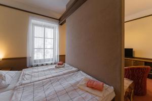 Postel nebo postele na pokoji v ubytování Hotel Amco