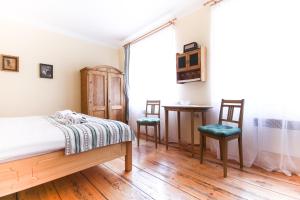 Uma cama ou camas num quarto em (Ne)vinná kavárna