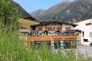 a building in the middle of a mountain at Appartement Oskar in Sölden