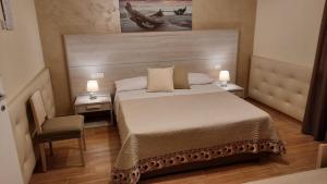Postel nebo postele na pokoji v ubytování Oasi Perla Del Mare Rooms