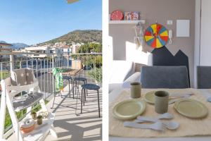 Camera con tavolo e balcone con vista. di Babyaccommodation Family Green a Pietra Ligure