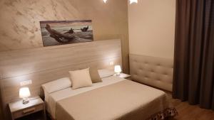 Postel nebo postele na pokoji v ubytování Oasi Perla Del Mare Rooms