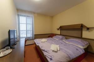 Postel nebo postele na pokoji v ubytování Hotel Amco