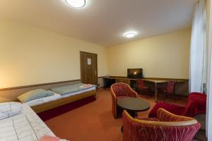 Postel nebo postele na pokoji v ubytování Hotel Amco