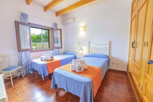A bed or beds in a room at Villa Ca na Quarta