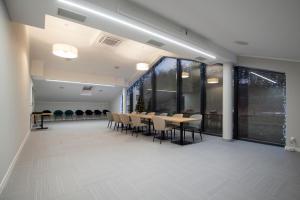 a conference room with a table and chairs at Hotel Jarzębata in Wisła