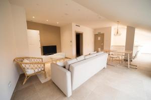 a living room with a couch and a table at Hostal Martínez in Villafranca