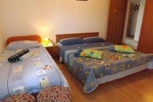 Postel nebo postele na pokoji v ubytování Ferienwohnung in Umag mit Terrasse, W-LAN, Waschmaschine 853-3