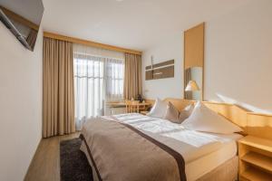 Łóżko lub łóżka w pokoju w obiekcie Hotel Central