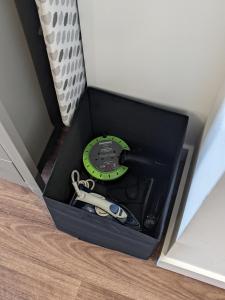 a black box with a watch and a pair of scissors at Middlehaven Studio in Middlesbrough