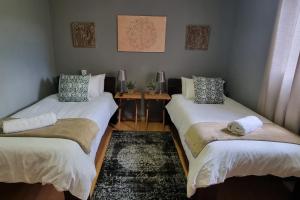 Llit o llits en una habitació de Houtgerus Gastehuis/Guesthouse
