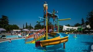 a water park with a slide in the water at Hotel Bella Italia in Peschiera del Garda