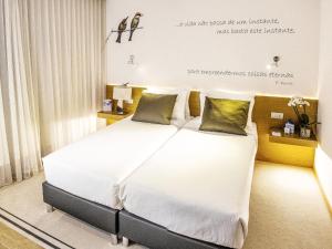Postel nebo postele na pokoji v ubytování TRYP by Wyndham Leiria + 24 fotografií