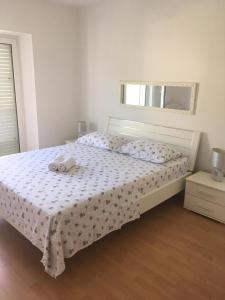 a bedroom with a bed with two towels on it at Apartment in Povlja with sea view, terrace, air conditioning, WiFi 3419-1 in Povlja