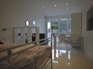 a bedroom with a bed and a table and chairs at Studio apartment in Povlja with sea view, terrace, air conditioning, WiFi 3419-4 in Povlja