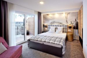 Letto o letti in una camera di Active Nature Resort DAS SeeMOUNT