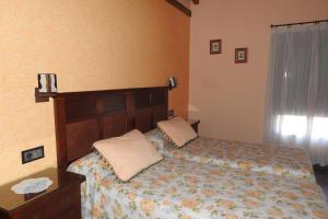 Łóżko lub łóżka w pokoju w obiekcie Casa Rural Monfragüe