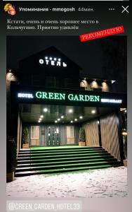 a green garden sign on the front of a building at Green Garden Hotel in Kol'chugino