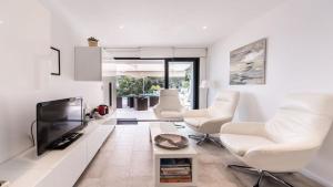 TV a/nebo společenská místnost v ubytování La DÉTENTE 3149