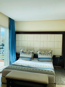 Säng eller sängar i ett rum på Dream's Hotel