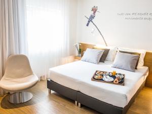 Postel nebo postele na pokoji v ubytování TRYP by Wyndham Leiria