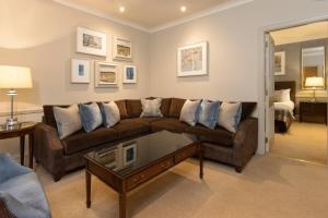 a living room filled with furniture and a couch at Thainstone House in Inverurie