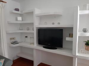 Televízia a/alebo spoločenská miestnosť v ubytovaní Bungalow Maspalomas, Campo Internacional