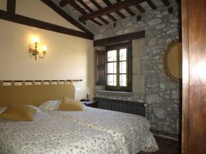 Cama o camas de una habitación en Castell de Llaés