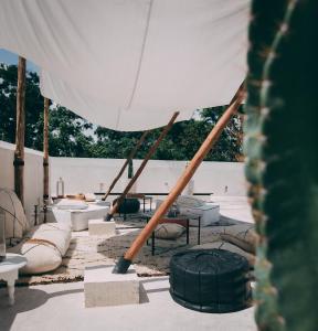 a view of a tent with tables and chairs at Ambre & Epices Jungle Hotel & Spa in Tulum