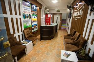 a waiting room with chairs and a counter in a store at Darak hotel in Aqaba