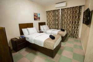 Postel nebo postele na pokoji v ubytování Darak hotel