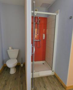 a bathroom with a toilet and a shower stall at Hôtel Azur Saint Junien Cit'Hotel in Saint-Junien