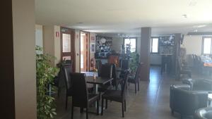 a dining room with chairs and a table at Hostal Rural San Andrés in Torres del Río