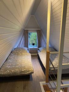 a room with two beds in a tent at Ferienhaus Rana in Wolfshagen