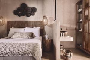 A bed or beds in a room at Noon Beyond Accommodation