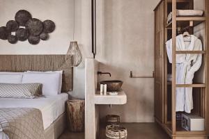 A bed or beds in a room at Noon Beyond Accommodation