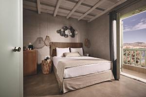 A bed or beds in a room at Noon Beyond Accommodation